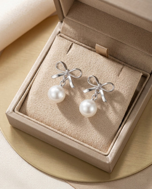 Silver Bow Pearl Drop Earrings – Elegant Pearl Ribbon Stud Drops