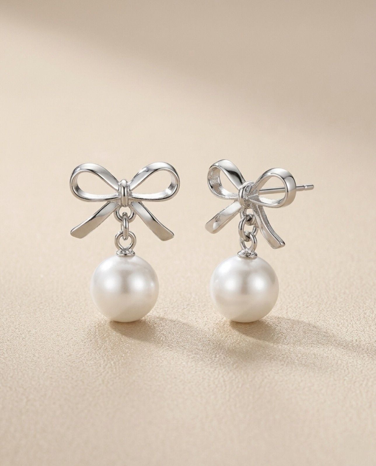 Silver Bow Pearl Drop Earrings – Elegant Pearl Ribbon Stud Drops