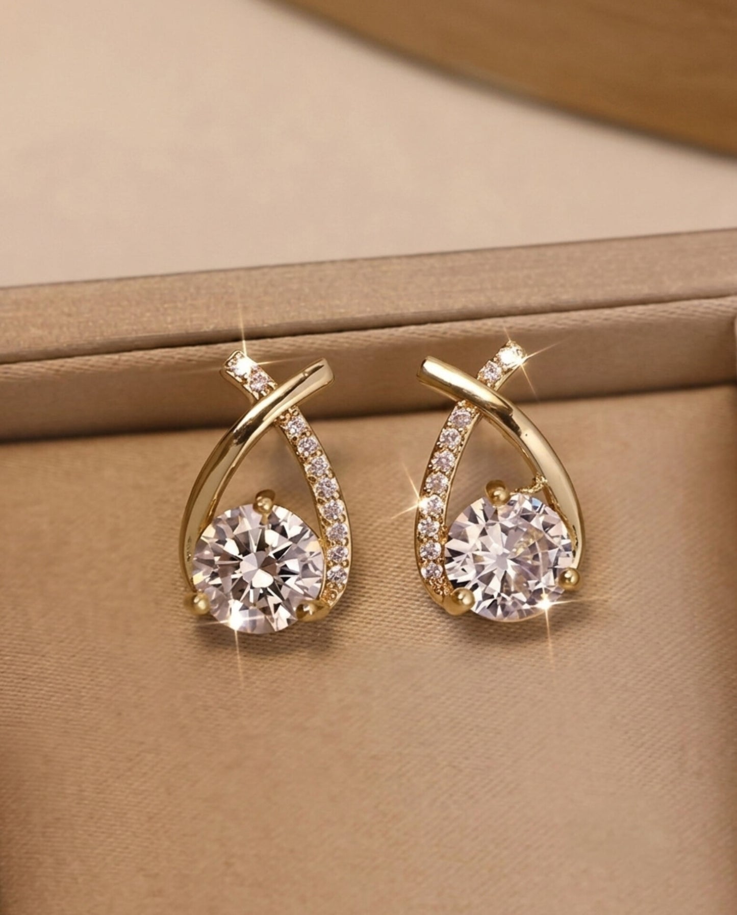 Gold Crossover CZ Stud Earrings – Curved Ribbon Solitaire Studs